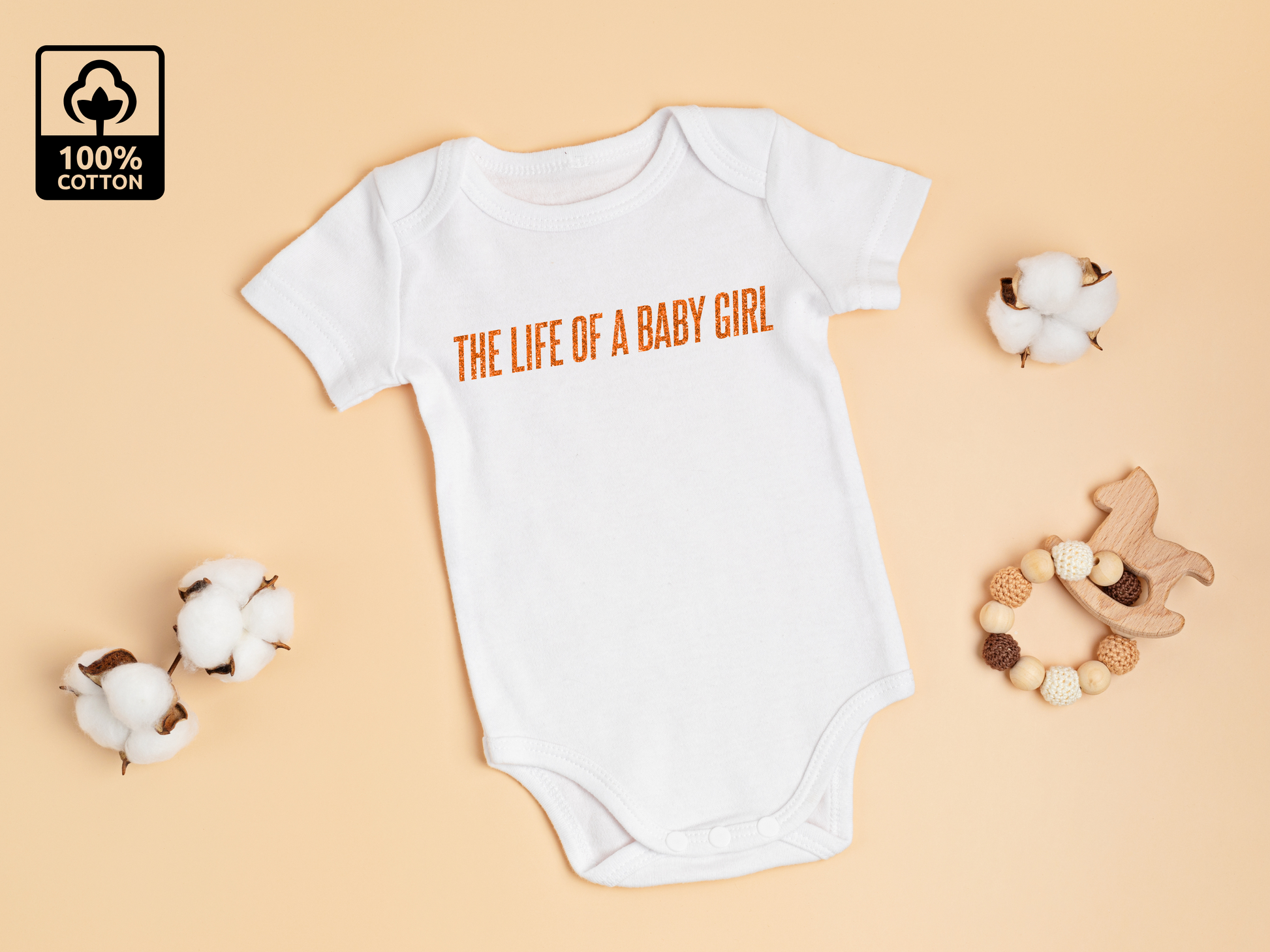 White baby vest with an orange glittery print that says 'The Life Of A Baby Girl'. The perfect gift for all the newest T.Swift fans! Great for pregnancy announcements or as a baby shower gift.