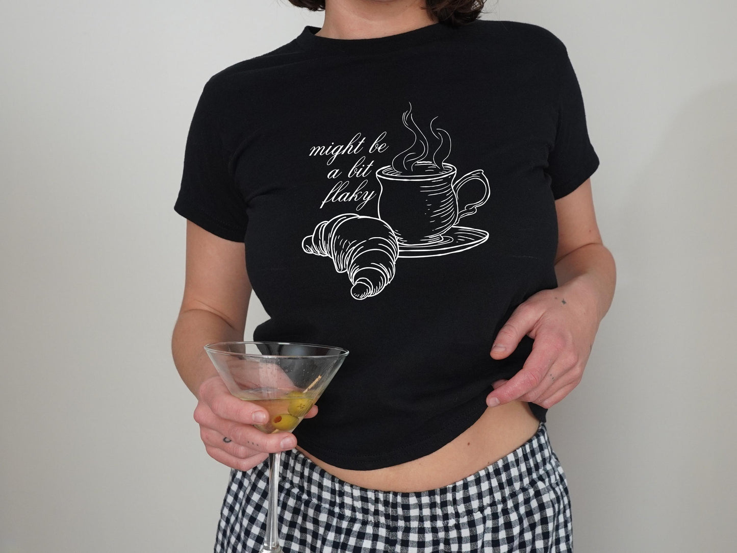 Might Be A Bit Flaky Baby Tee, Funny Slogan T-Shirt, Coffee Club Shirt, Croissant Shirt, Coffee Lover Shirt, Womens White Baby Tee T-Shirt